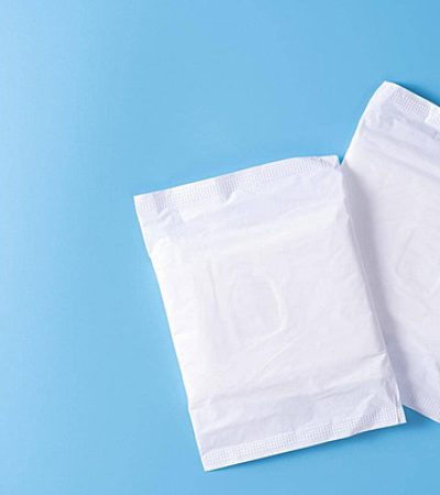 pngtree-top-view-of-menstrual-care-productssanitary-pad-and-napkin-on-blue-background-for-feminine-hygiene-photo-image_35329668